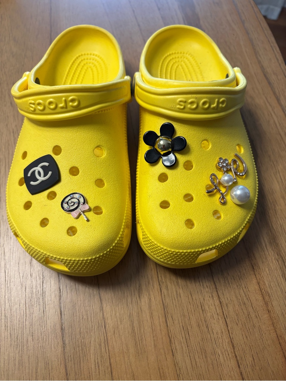 CROCS Women size 10 Bright Yellow Clog Sandals with Charm Accents. Barley worn.